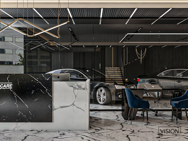 55 car showroom with marble reception desk and cars in the background in Dubai
