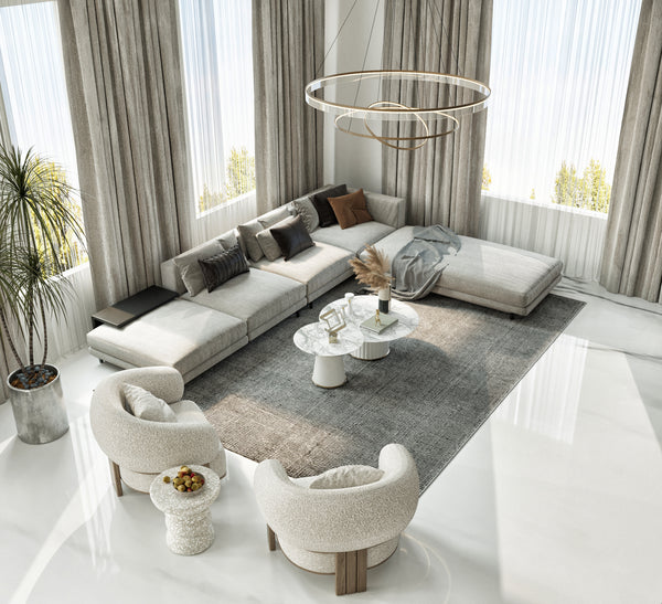 Modern living room with a sectional sofa, armchairs, and a coffee table.