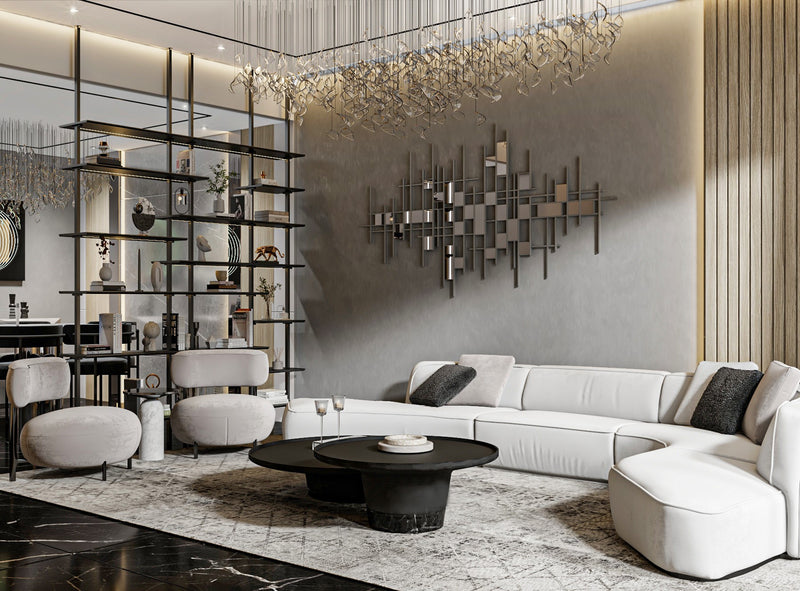 Modern living room with white sectional sofa, black coffee table, and decorative wall art.