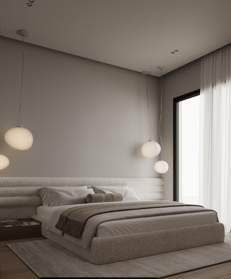 Modern bedroom with a bed, lamps, and large window.