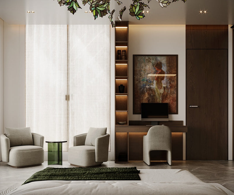 Modern master bedroom with gray armchairs, a bed, and a wall-mounted TV.