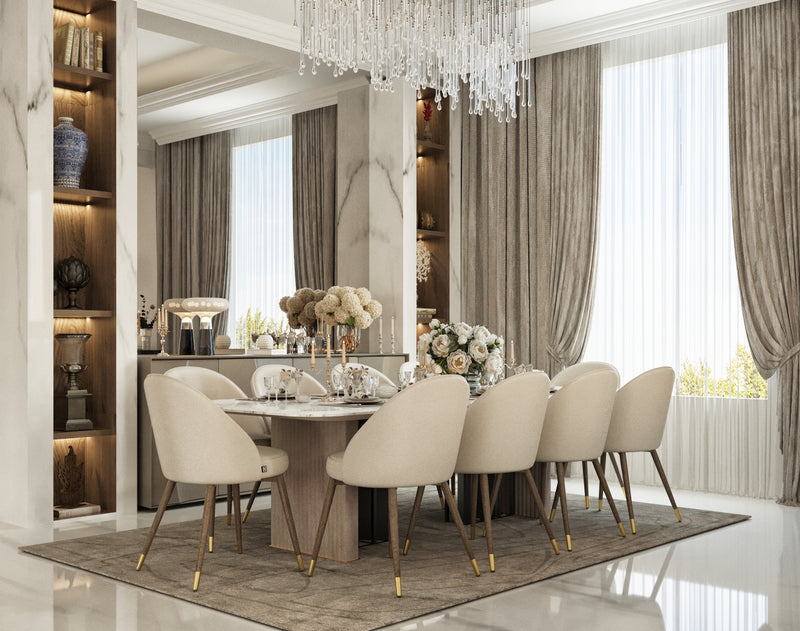 Elegant dining room with a table and chairs, chandelier, and large windows.