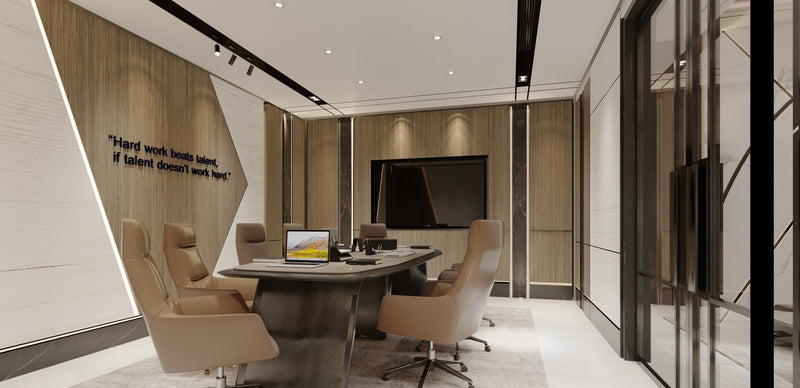 Modern office conference room with a large round table and chairs.