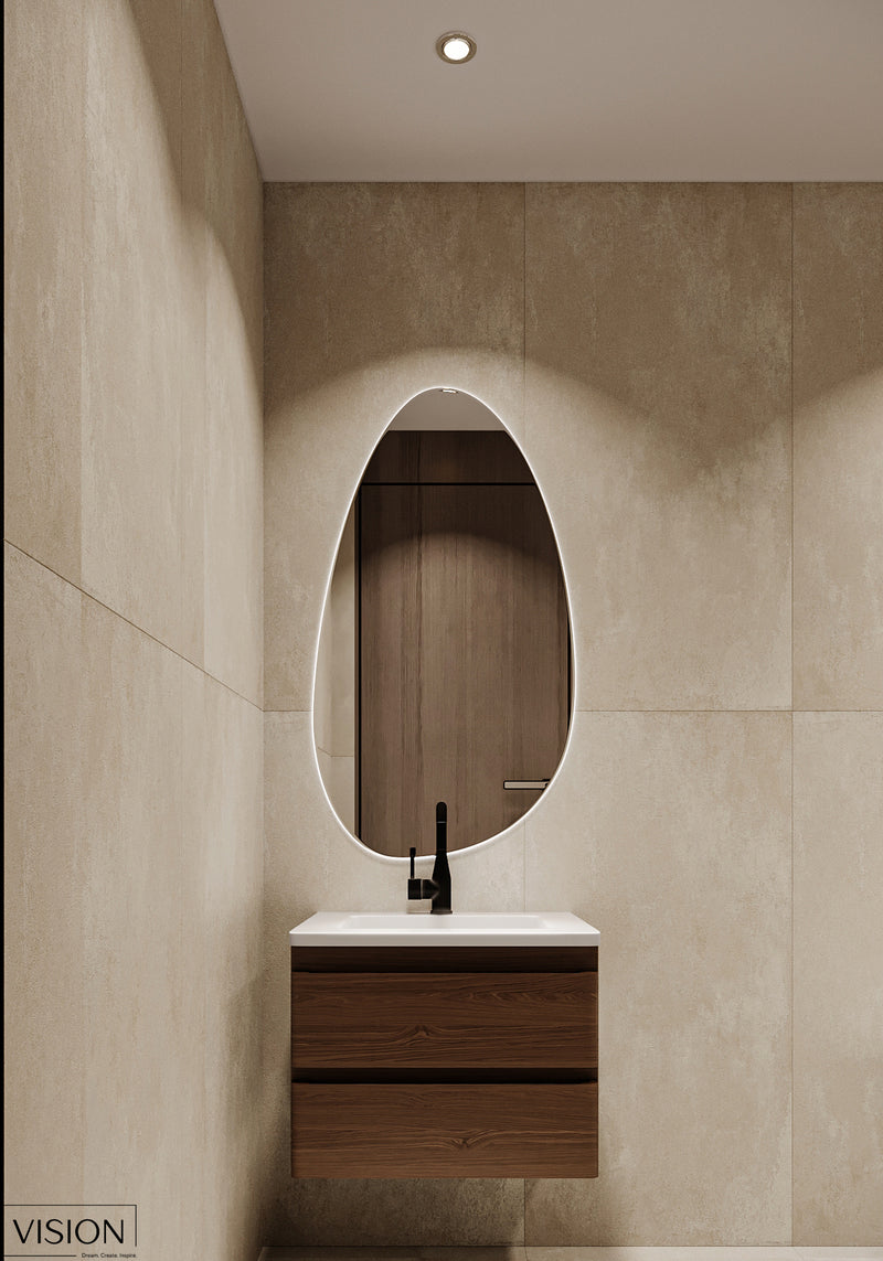 Modern bathroom with a wooden vanity and oval mirror.