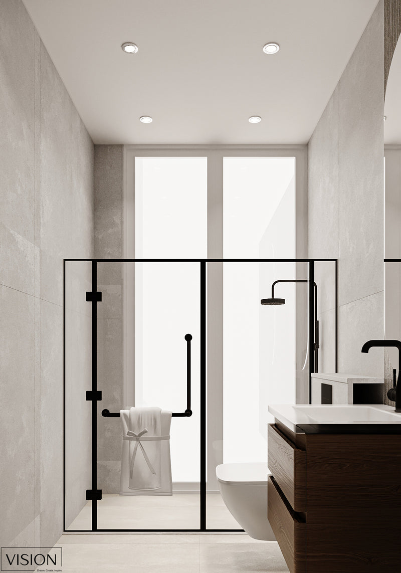 Modern bathroom with glass shower enclosure, toilet, and vanity.