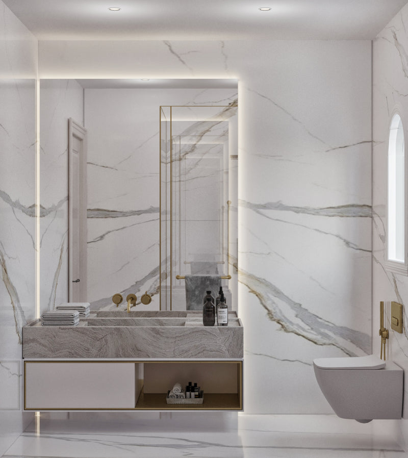 Modern bathroom with marble walls, a vanity, and a toilet.