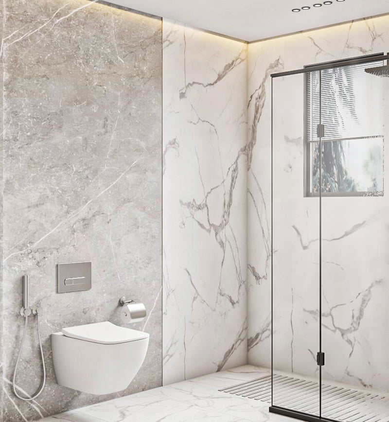 Modern bathroom with marble walls and a glass shower enclosure.