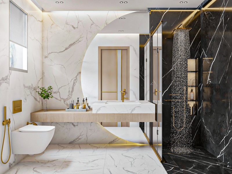 Modern bathroom with marble walls and floor, gold fixtures, and a chandelier.