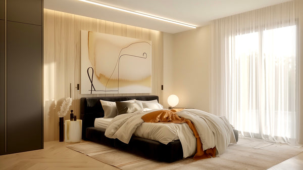 Modern bedroom with a bed, artwork on the wall, and large windows.