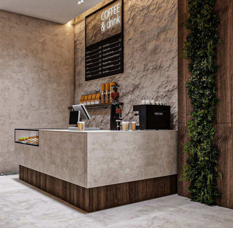 Modern coffee bar with a digital menu board and coffee-making equipment.