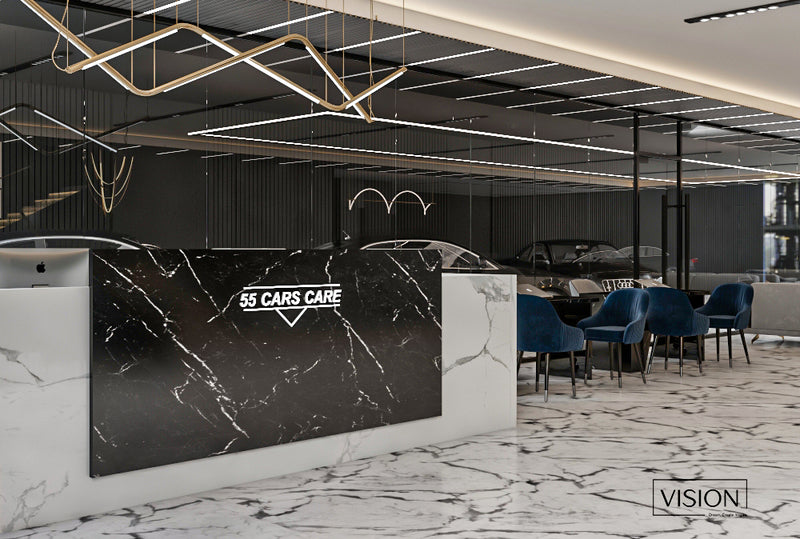 Modern interior of a car care center with marble walls and '55 Cars Care' branding.