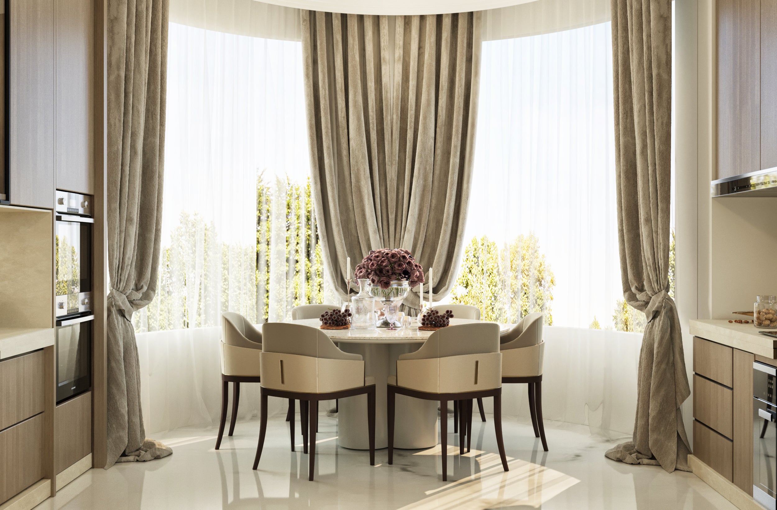 Modern kitchen with a dining area featuring a round table and chairs.