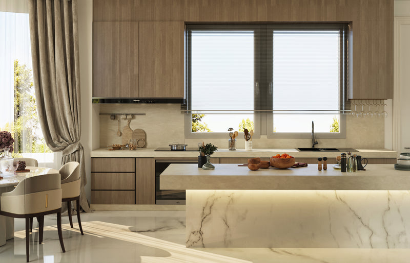 Modern kitchen with marble island, wooden cabinets, and large window