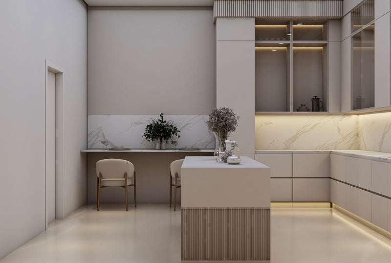 Modern kitchen with white cabinets, marble countertops, and minimal decor.