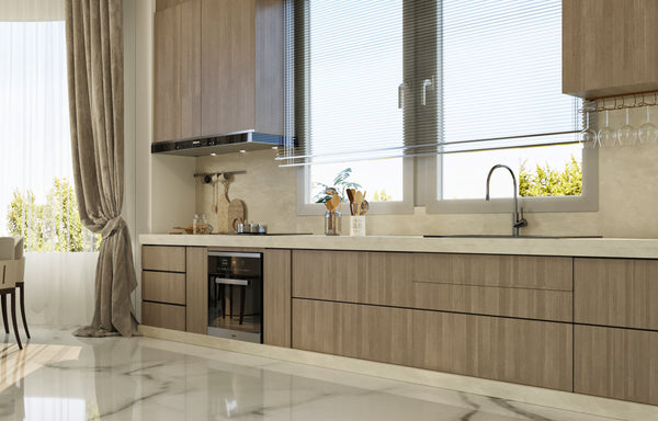 Modern kitchen with wooden cabinets, marble countertop, and large window.