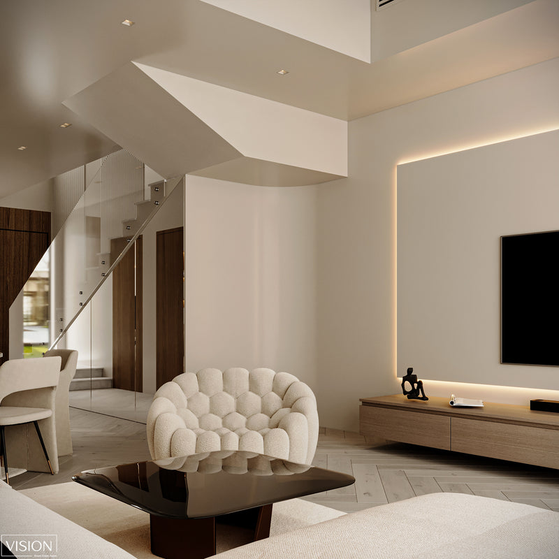 Modern living room with a white armchair, coffee table, and TV.