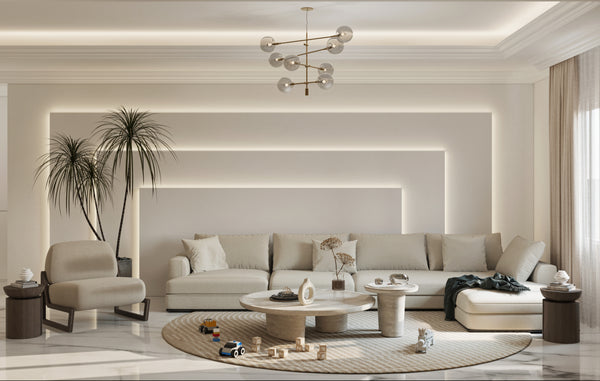 Modern living room with beige sofa, coffee table, and decorative items.
