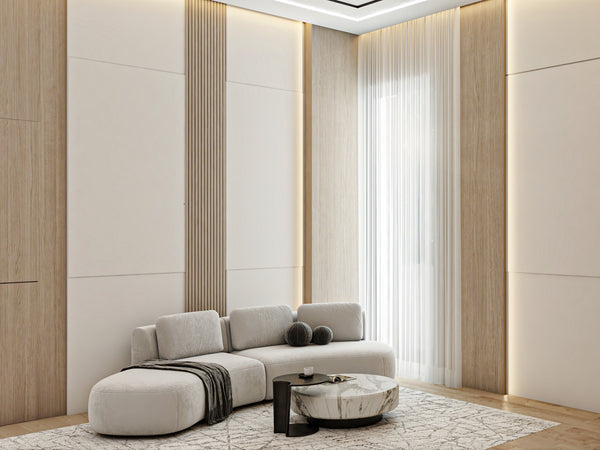 Modern luxury living room with a gray sofa, coffee table, and decorative items.