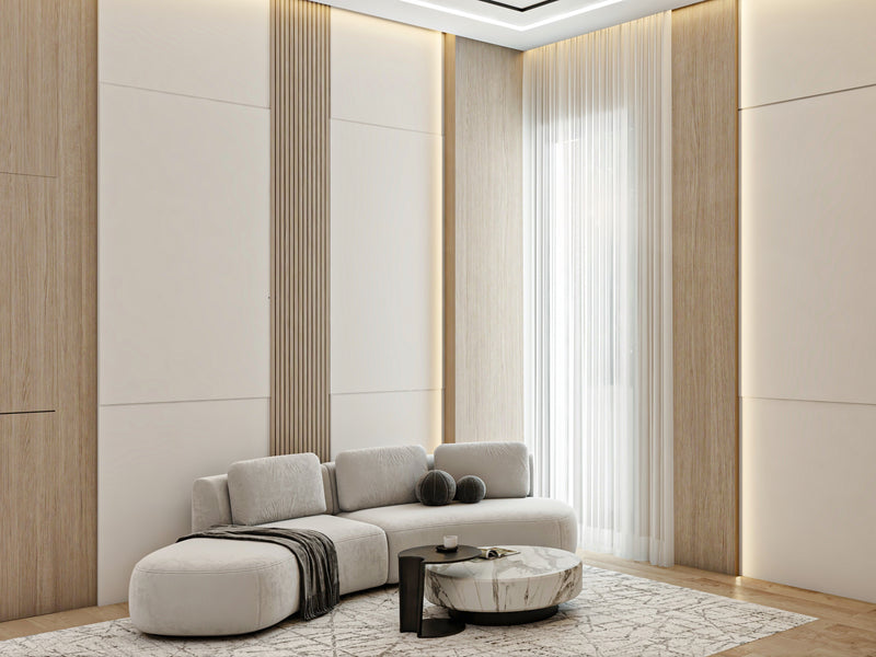 Modern luxury living room with a gray sofa, coffee table, and decorative items.