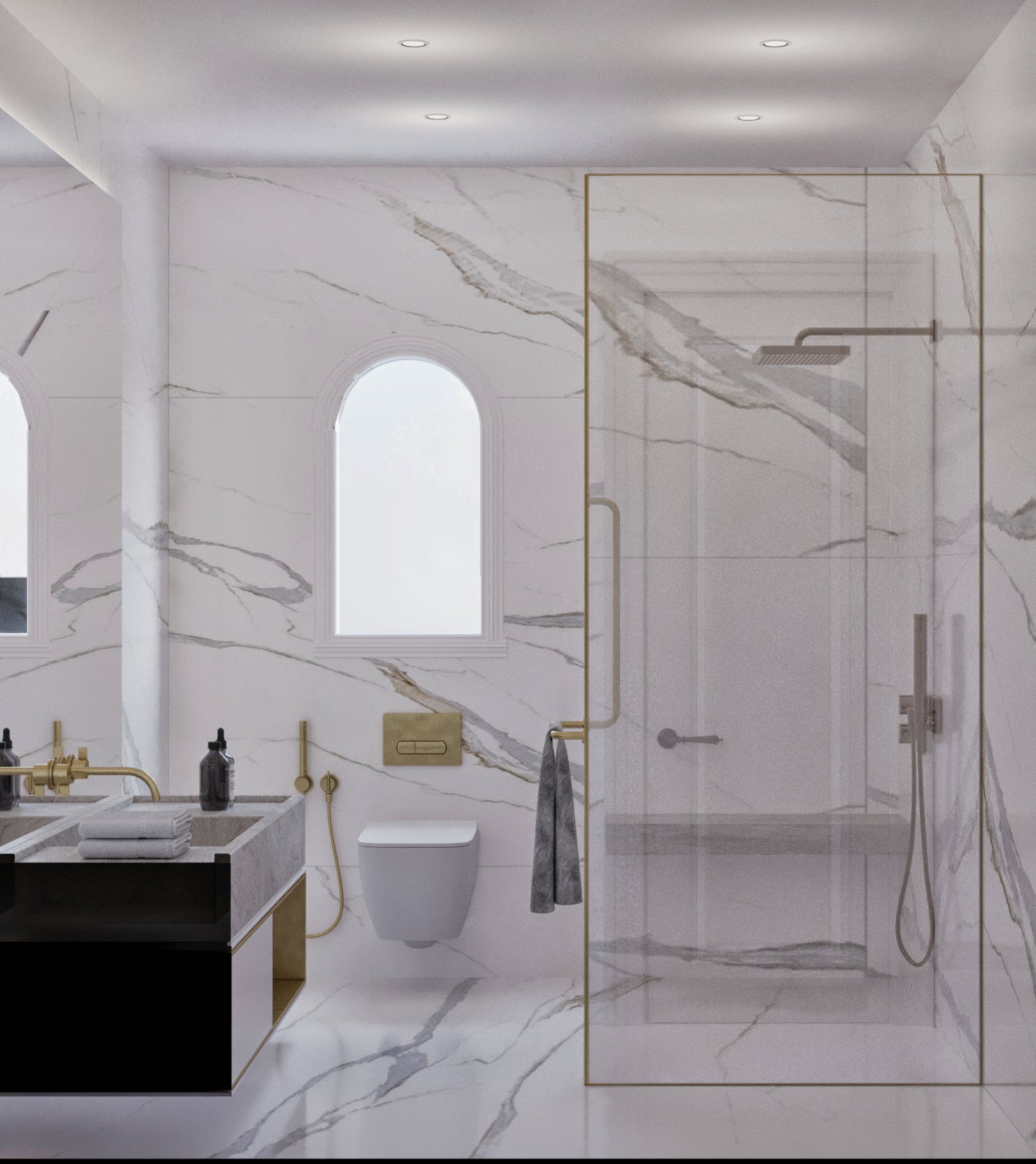 Modern master bedroom's bathroom with marble walls, glass shower enclosure, and gold fixtures.