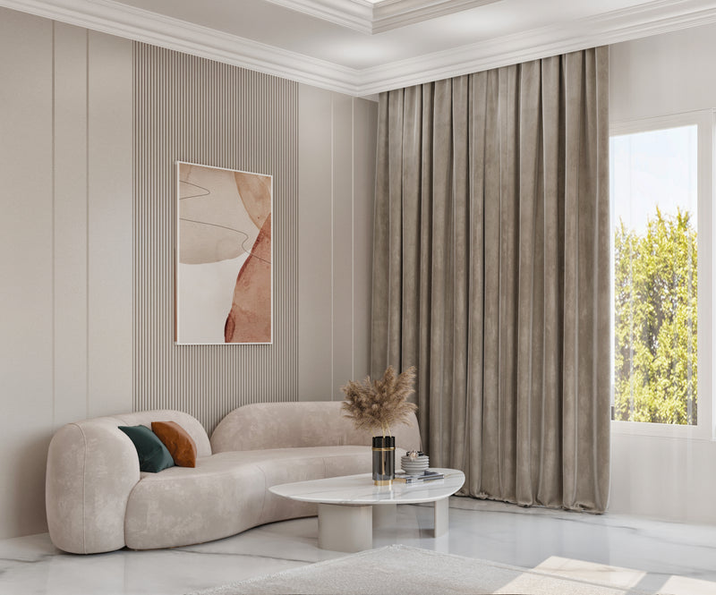 Modern master bedroom with a beige sofa, coffee table, and decorative elements.