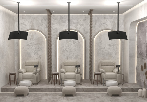 Modern spa interior with beige armchairs, ottomans, and decorative elements.