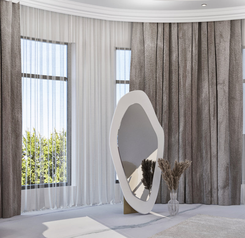 Modern standing mirror in a Adult girl’s bedroom  with large windows and curtains