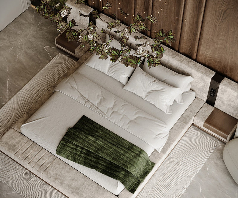 Neatly made bed with white bedding and green blanket in a master bedroom setting.