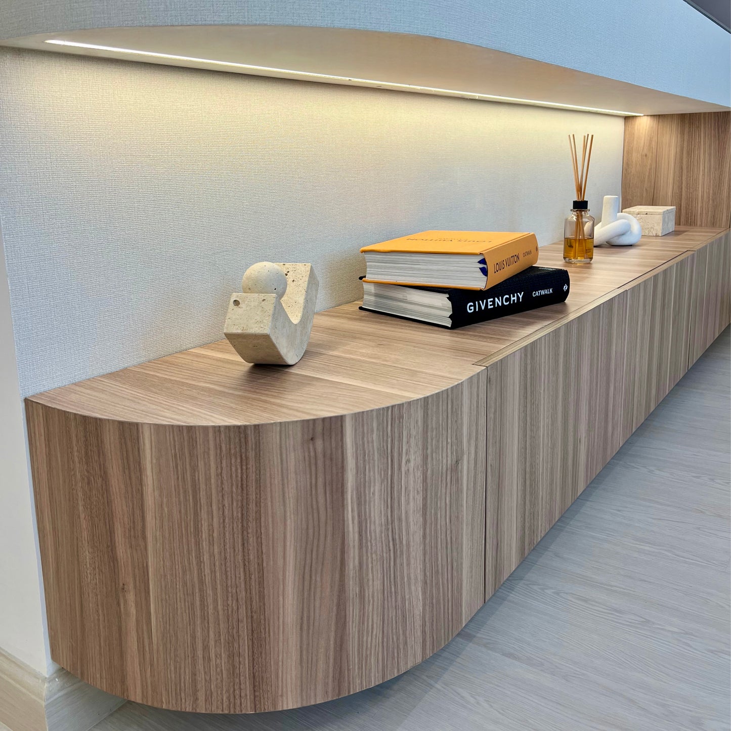 Wooden tv cabinet with decorative items in a modern setting